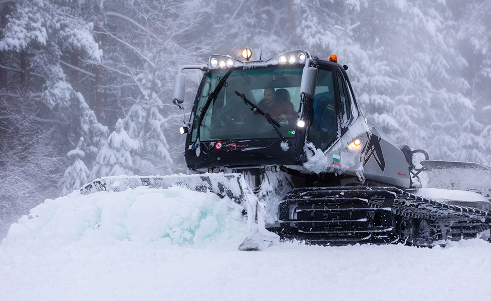Snow groomers used for ice roads and other roads built in wooded areas.